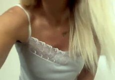 blonde shows off big shaved pussy lips up close in homemade vid