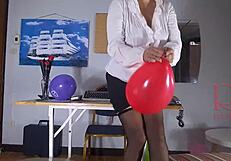 secretary sneaks balloons into office and pops off masturbating in nylons