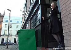 Blonde exhibitionist Amber West risks upskirt pussy flash in public outdoors