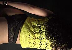 shaking her ass and hips rhythmically in sexy outfit with long nails