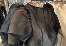 She slips into sheer transparent outfits in mall fitting room flashing big tits