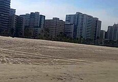 Relaxed solo moment by the beach lighthouse