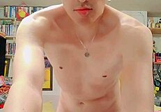 skinny guy strokes his big cock solo in the living room