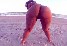 bare ebony ass dances naked on beach