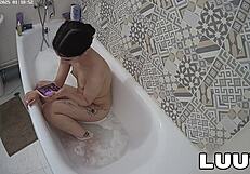 Luuv Vilika bares small tits in private late-night bathroom flash voyeur